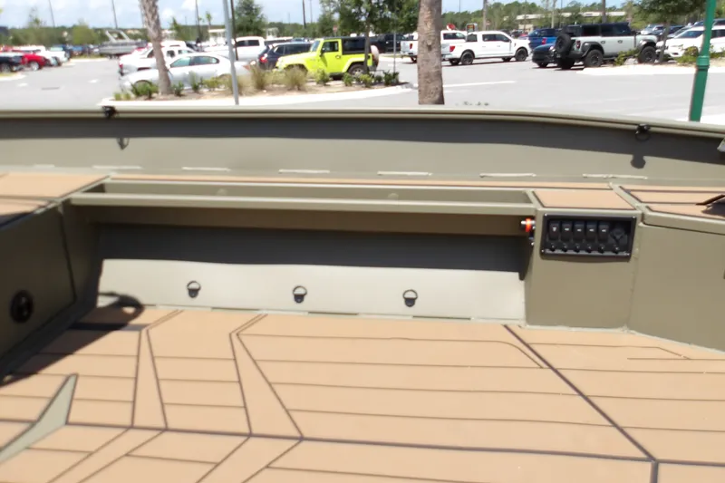 Slide: The Image of Interior view of 2027 Tracker Grizzly 1553 Timber boat in a parking lot. - 16