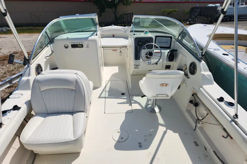 Slide: The Image of 2004 Hydra-Sports Lightning 202 DC boat interior with steering console and seating. - 7