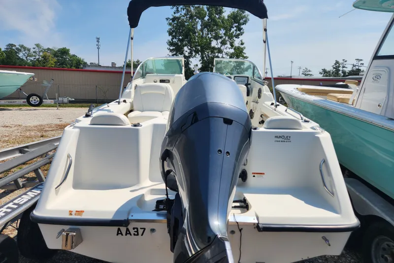 Slide: The Image of 2004 Hydra-Sports Lightning 202 DC boat with outboard motor, parked on a trailer. - 4