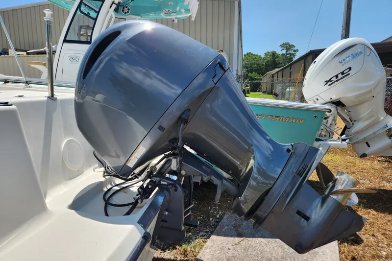 Slide: The Image of 2004 Hydra-Sports Lightning 202 DC boat with powerful outboard motor in a sunny outdoor setting. - 18