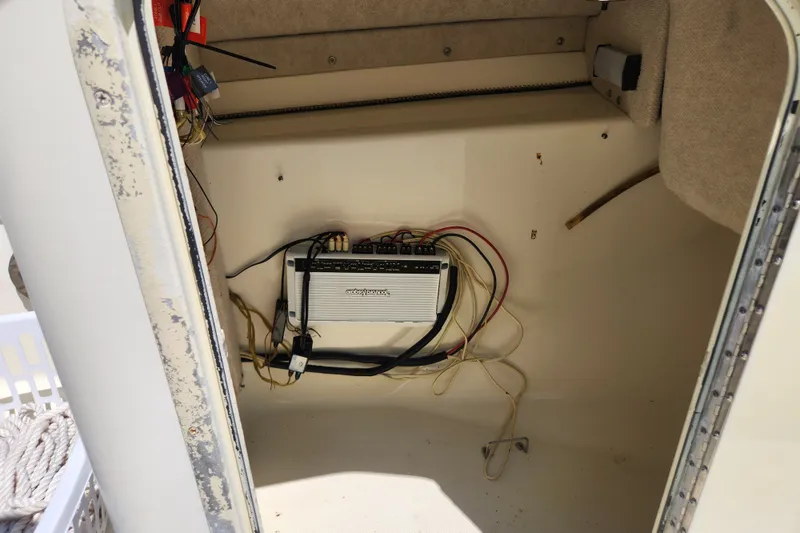 Slide: The Image of 2004 Hydra-Sports Lightning 202 DC boat interior with wiring and electronic equipment. - 15