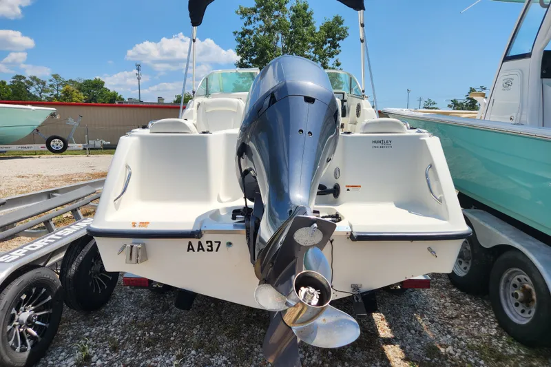 Slide: The Image of 2004 Hydra-Sports Lightning 202 DC boat with outboard motor, parked on a trailer. - 20