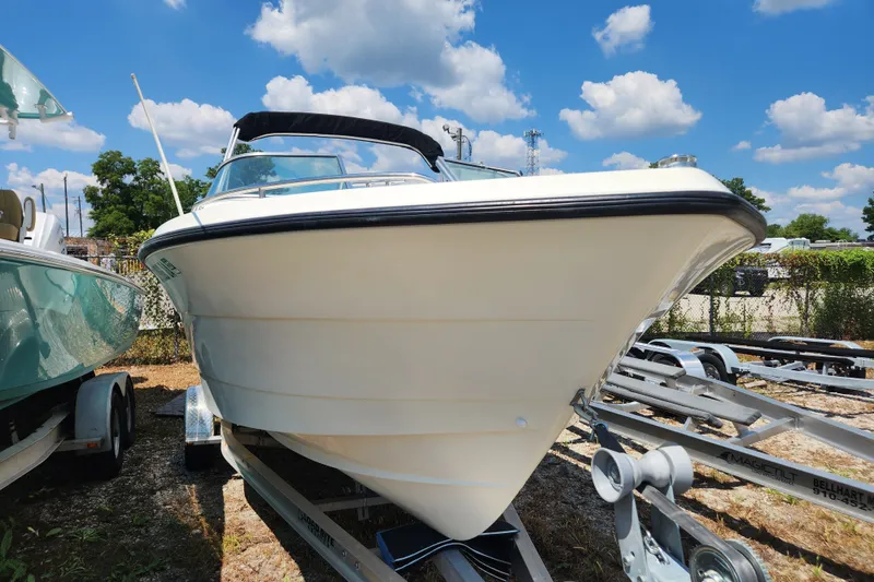 Slide: The Image of 2004 Hydra-Sports Lightning 202 DC boat on trailer under a bright blue sky. - 3