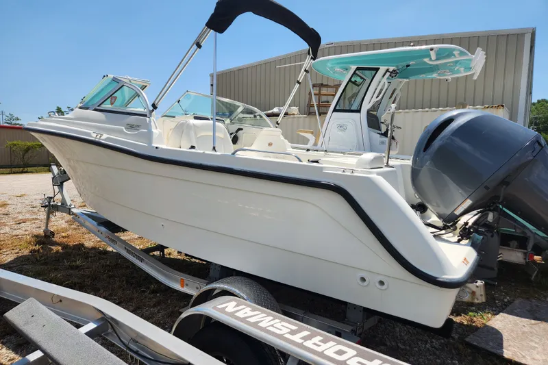 Slide: The Image of 2004 Hydra-Sports Lightning 202 DC boat on trailer, parked outdoors. - 1