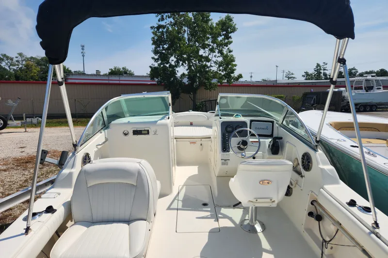Slide: The Image of 2004 Hydra-Sports Lightning 202 DC boat interior with steering wheel and seating. - 8