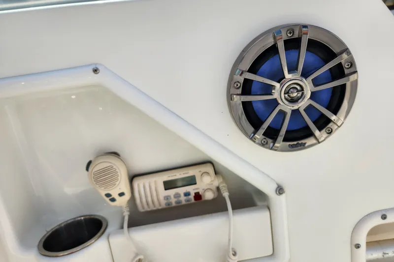 Slide: The Image of 2004 Hydra-Sports Lightning 202 DC boat interior with speaker and radio equipment. - 14