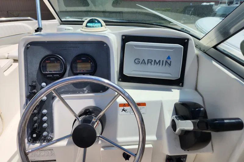 Slide: The Image of 2004 Hydra-Sports Lightning 202 DC dashboard with Garmin navigation and Yamaha gauges. - 5