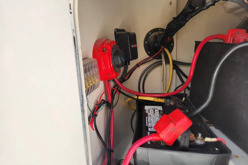 Slide: The Image of 2004 Hydra-Sports Lightning 202 DC boat battery compartment with wiring and connections. - 16