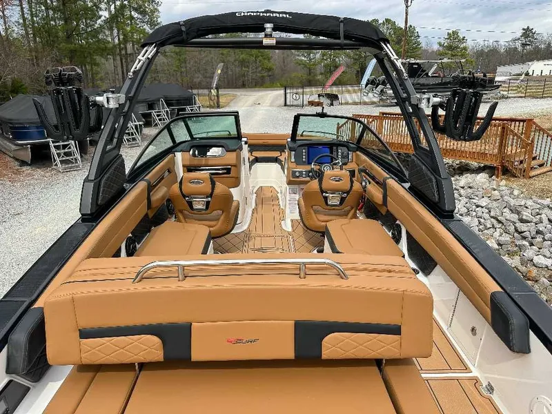 Slide: The Image of The image shows the interior of a 2026 Chaparral GTS 6 boat with brown leather seats. - 13