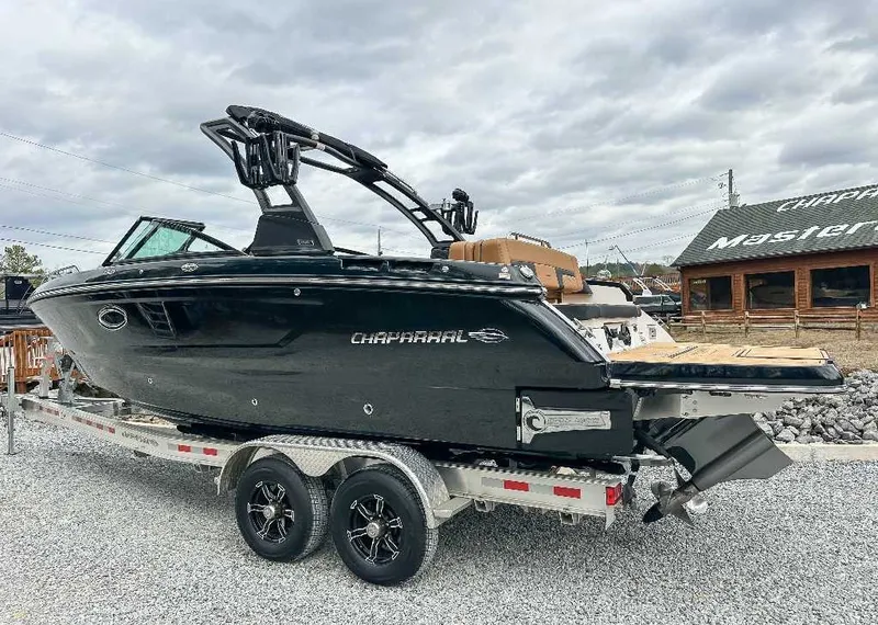 Slide: The Image of A black 2026 Chaparral GTS 6 boat on a trailer, featuring sleek design and modern lines. - 8