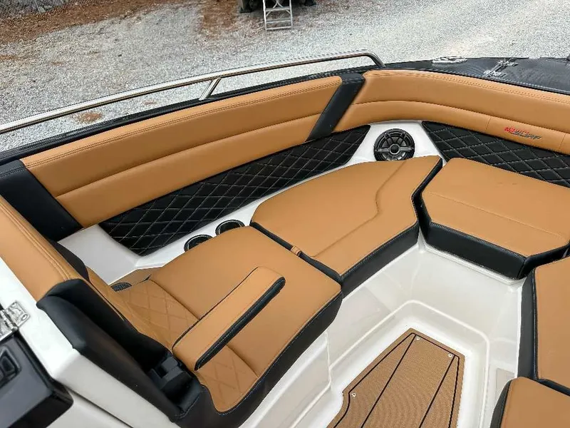 Slide: The Image of The image shows the interior of a 2026 Chaparral GTS 6 with sleek brown upholstery. - 17