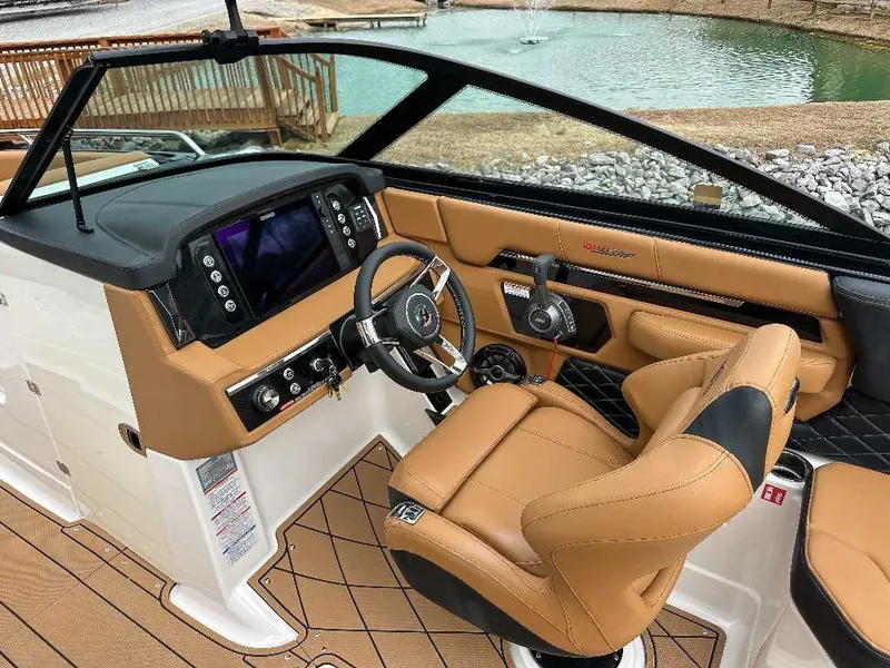 Slide: The Image of The image shows the cockpit of a 2026 Chaparral GTS 6 with brown leather seats. - 23