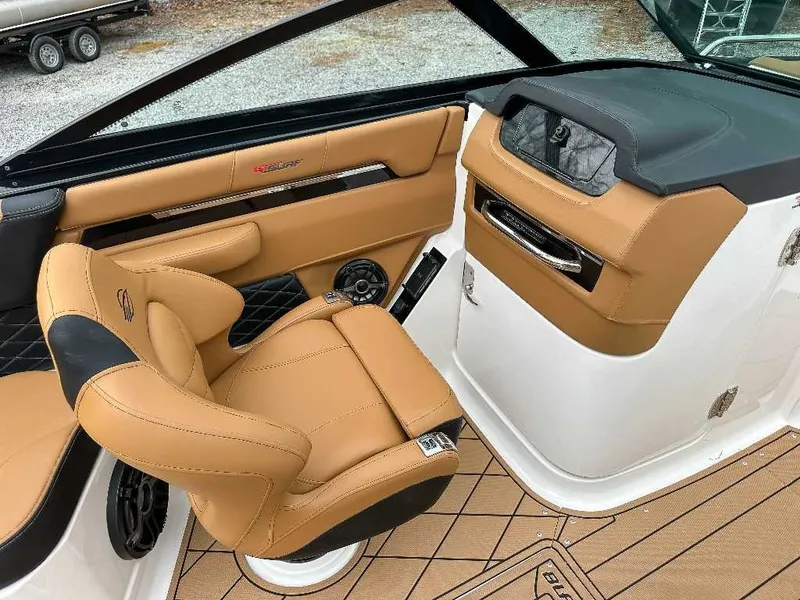 Slide: The Image of The image shows the interior of a 2026 Chaparral GTS 6 with beige leather seating. - 21