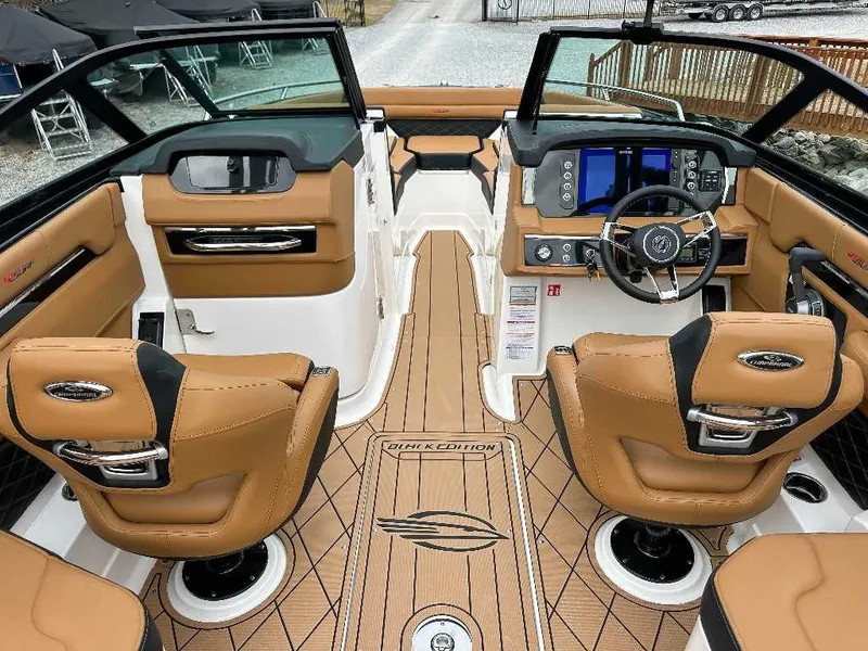 Slide: The Image of Interior of a 2026 Chaparral GTS 6 with brown leather seats and a modern dashboard. - 15