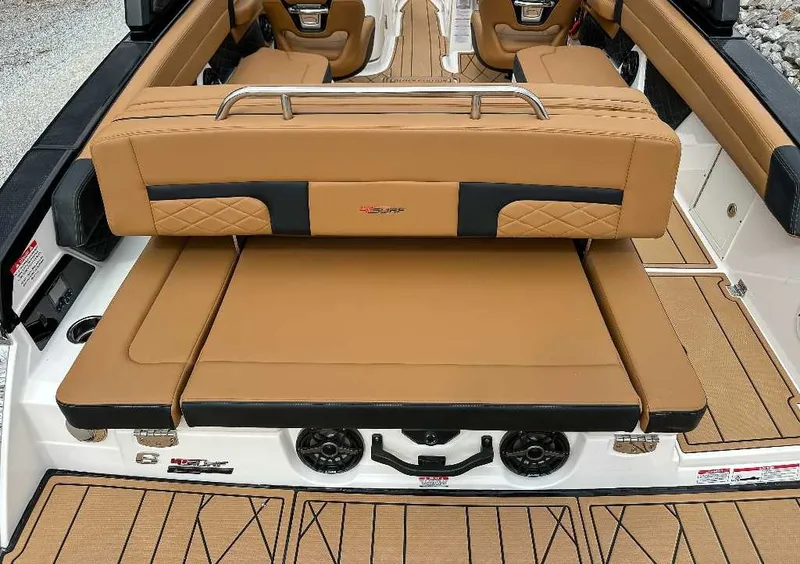 Slide: The Image of The image shows the luxurious interior of a Chaparral GTS 6 boat with brown leather seats. - 11