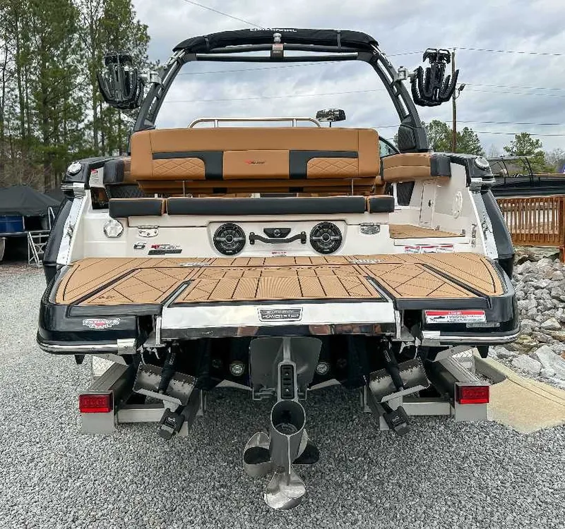 Slide: The Image of Rear view of a 2026 Chaparral GTS 6 with brown upholstery and modern features. - 10
