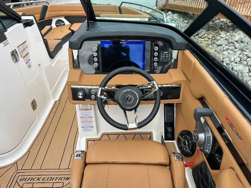 Slide: The Image of The image shows the cockpit of a 2026 Chaparral GTS 6 with a modern steering wheel and large display. - 24