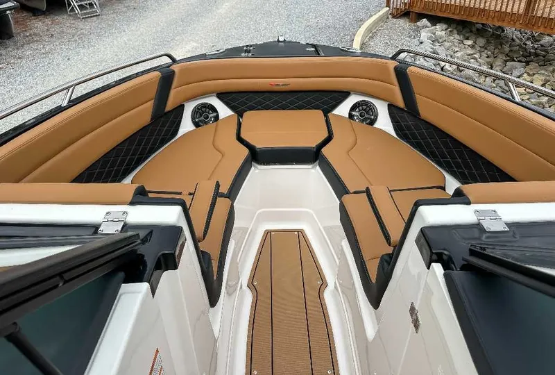 Slide: The Image of The image shows the bow area of a Chaparral GTS 6 boat with sleek, cushioned seating. - 16