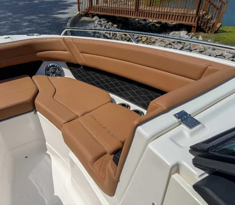 Slide: The Image of The image shows the bow area of a 2026 Chaparral GTS 6 with brown upholstery. - 11