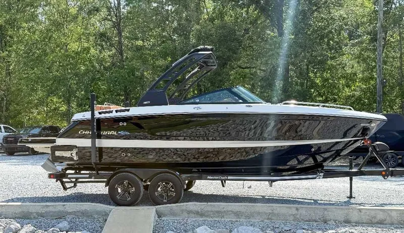 Slide: The Image of 2026 Chaparral GTS 6 on a trailer, surrounded by trees and cars. - 6