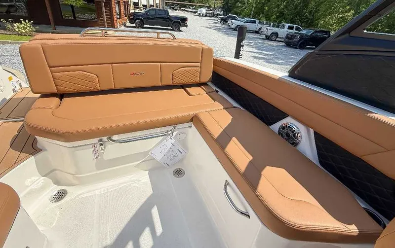 Slide: The Image of The image shows the interior of a 2026 Chaparral GTS 6 with brown leather seating. - 17