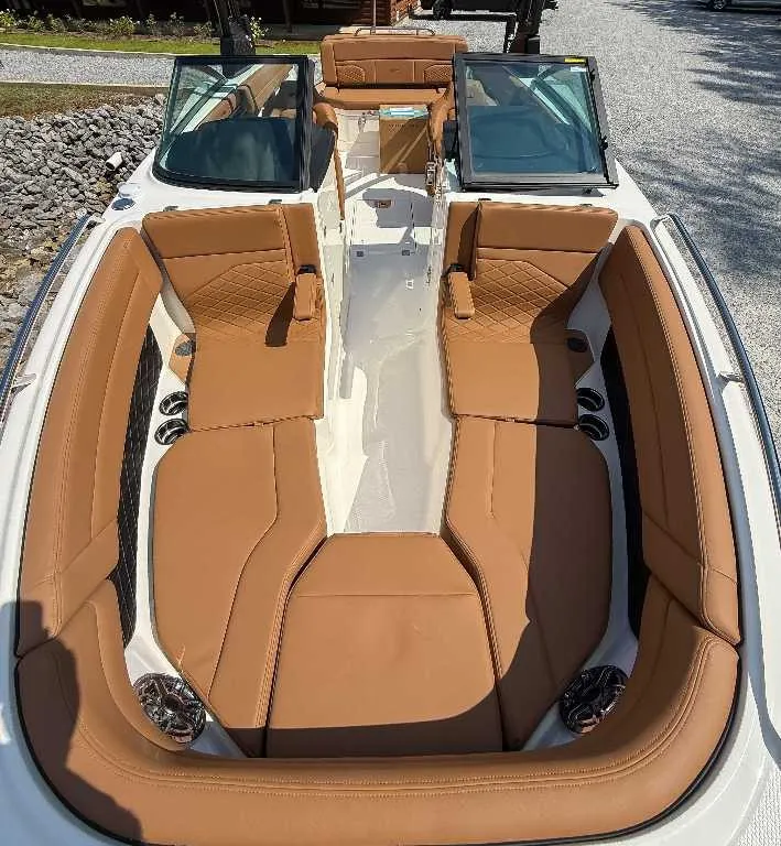 Slide: The Image of Chaparral GTS 6 2026: Luxurious brown leather seats, modern design, spacious interior, perfect for leisure cruising. - 12