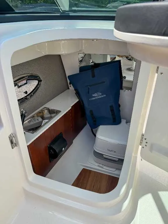 Slide: The Image of Interior of a 2026 Chaparral GTS 6 featuring storage and a toilet. - 14