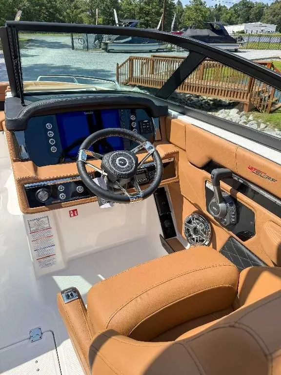 Slide: The Image of The image shows the cockpit of a 2026 Chaparral GTS 6 with a modern steering wheel and digital dashboard. - 15
