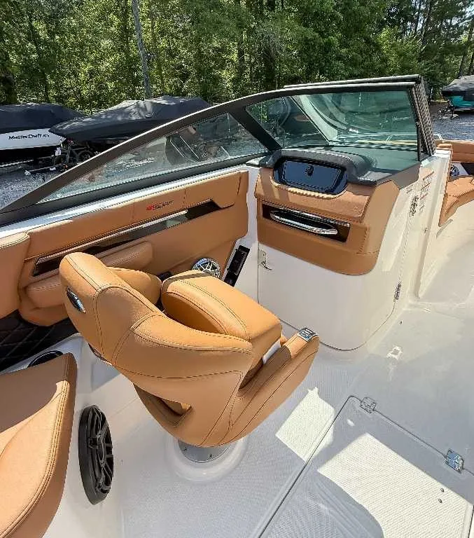 Slide: The Image of The image shows the cockpit of a 2026 Chaparral GTS 6 with beige leather seats. - 13