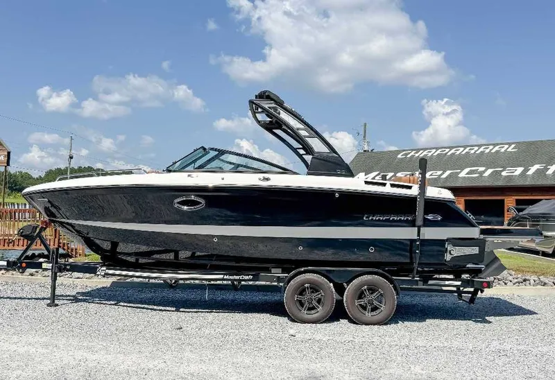 The Image of 2026 Chaparral GTS 6 on a trailer, featuring a sleek black hull and modern design. - 1