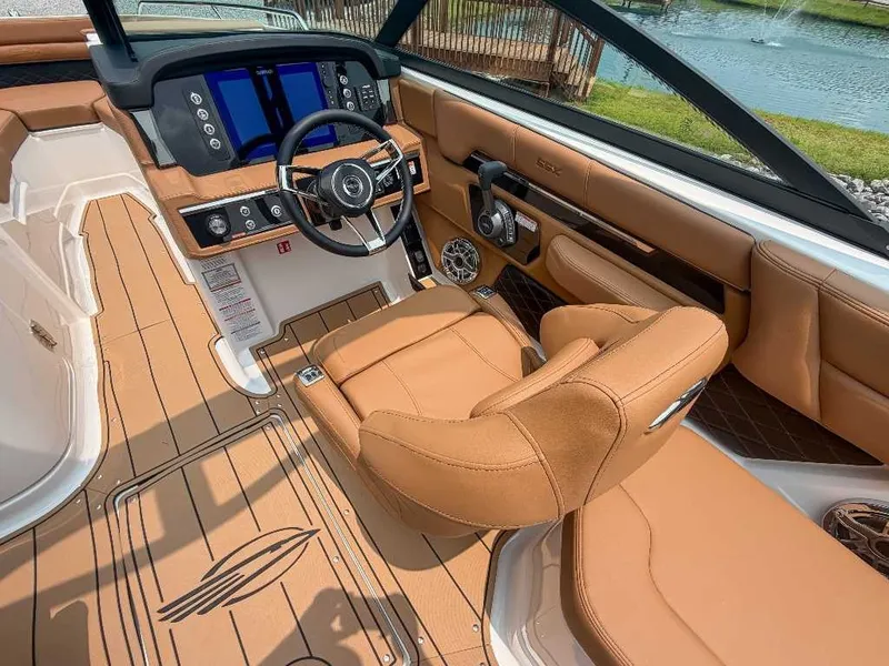 Slide: The Image of The image shows the cockpit of a 2026 Chaparral SSX 6 with luxurious leather seating and a modern dashboard. - 21