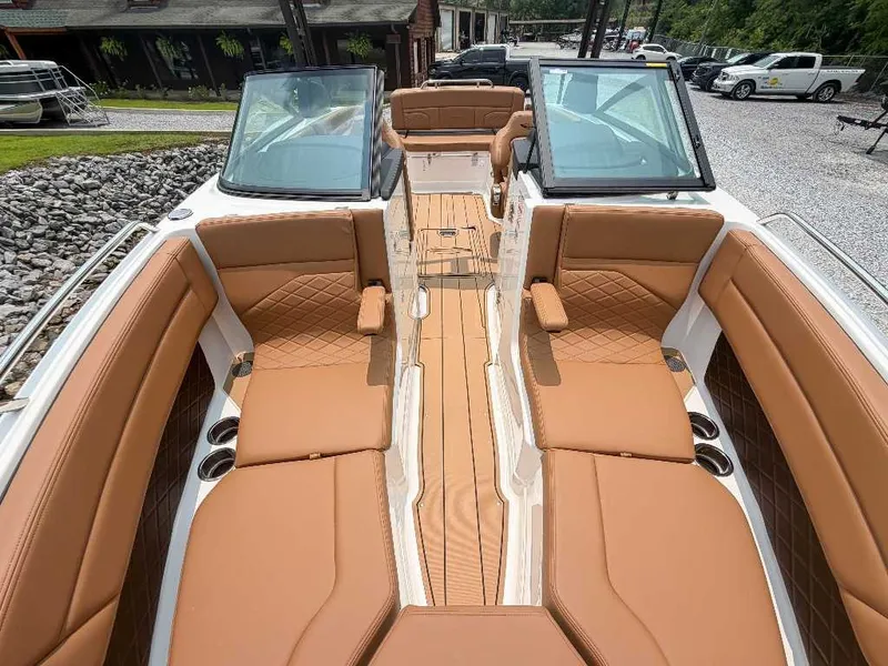 Slide: The Image of 2026 Chaparral SSX 6 with luxurious brown leather seating and sleek glass windshields. - 17