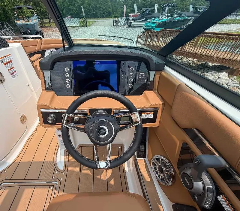 Slide: The Image of The image shows the cockpit of a 2026 Chaparral SSX 6 with a modern steering wheel and large display. - 22