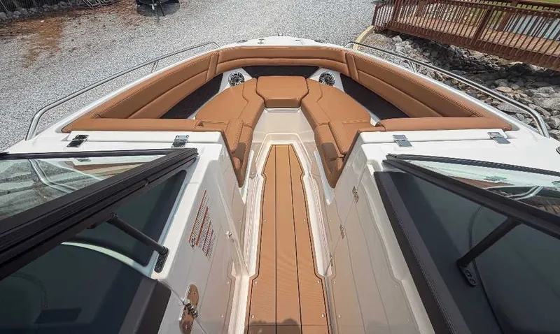 Slide: The Image of The image shows the bow of a 2026 Chaparral SSX 6 with brown upholstery. - 16