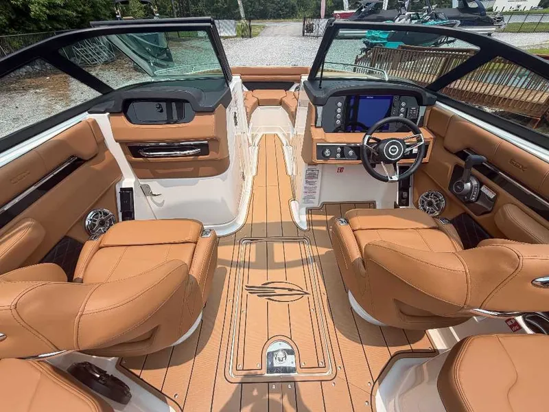 Slide: The Image of The image shows the cockpit of a 2026 Chaparral SSX 6 with luxurious leather seats and modern electronics. - 15