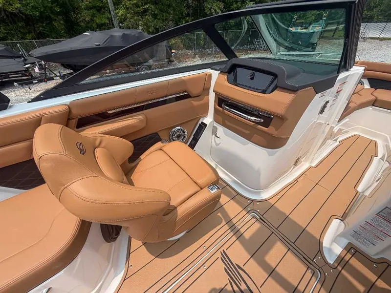 Slide: The Image of The image shows the cockpit of a 2026 Chaparral SSX 6 with luxurious leather seating. - 19