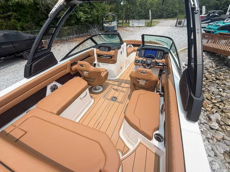 Slide: The Image of Chaparral SSX 6 2026: Luxurious interior with brown leather seating and modern dashboard. - 14