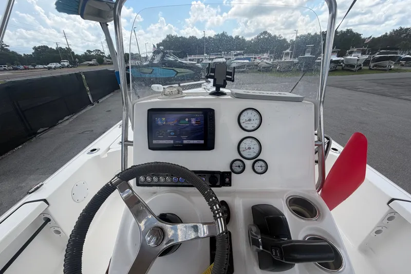 Slide: The Image of 2020 Tidewater 2110 Bay Max boat dashboard with steering wheel and gauges. - 16