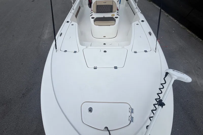 Slide: The Image of The image shows the deck of a 2020 Tidewater 2110 Bay Max boat with a trolling motor. - 39