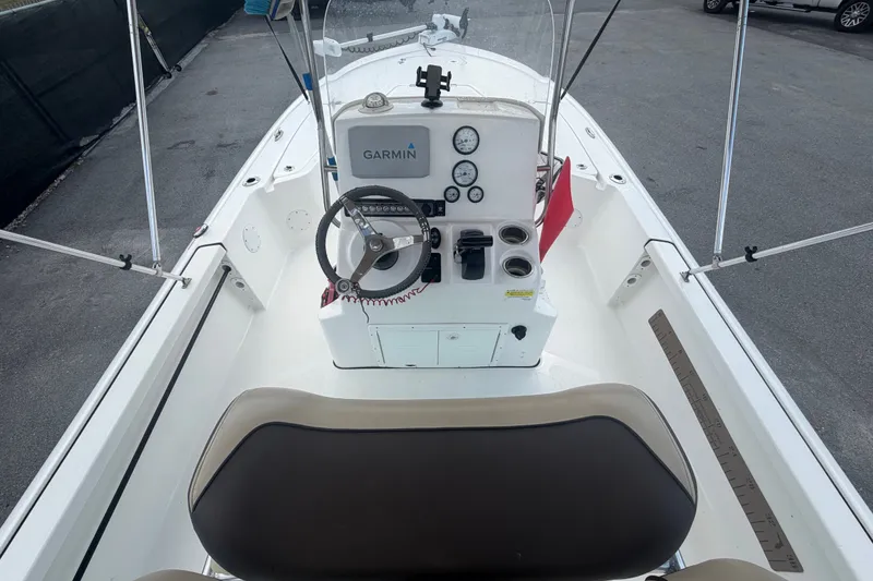 Slide: The Image of 2020 Tidewater 2110 Bay Max boat interior with Garmin navigation system and steering console. - 14