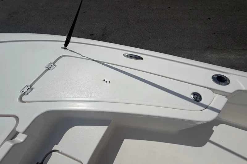 Slide: The Image of 2020 Tidewater 2110 Bay Max boat deck with storage compartment and rod holder. - 32