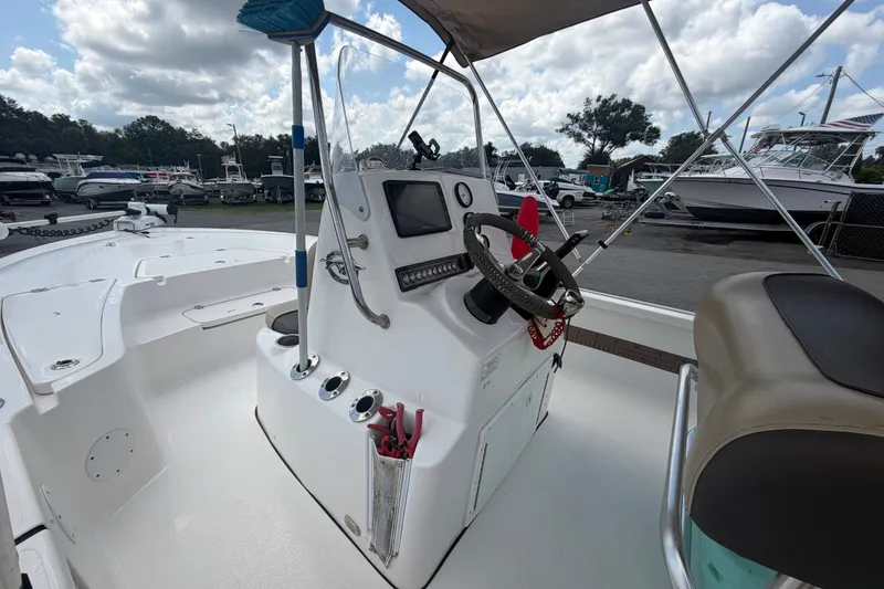 Slide: The Image of 2020 Tidewater 2110 Bay Max boat interior with steering console and seating. - 25
