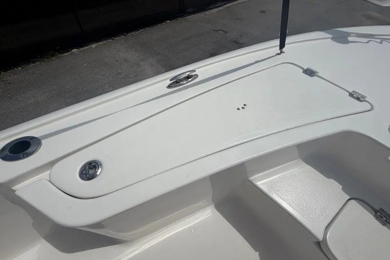 Slide: The Image of 2020 Tidewater 2110 Bay Max boat deck with storage compartments and rod holders. - 28