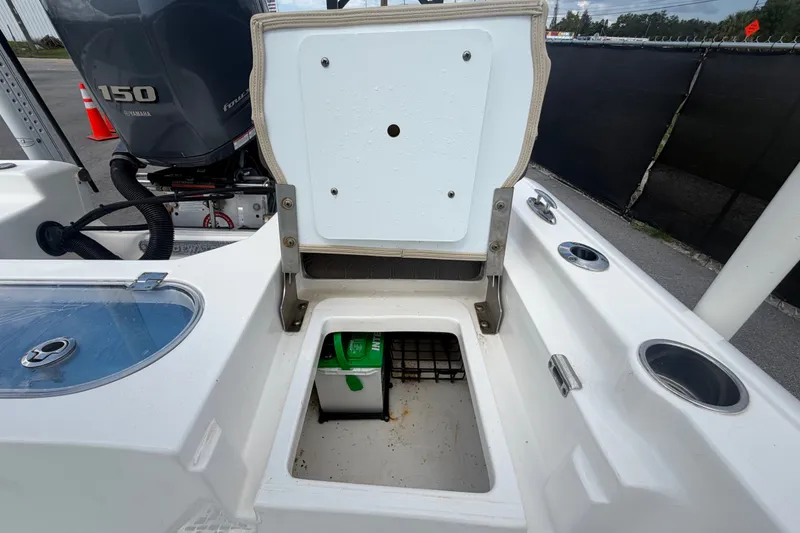Slide: The Image of 2020 Tidewater 2110 Bay Max boat with open storage compartment and Yamaha 150 engine. - 56