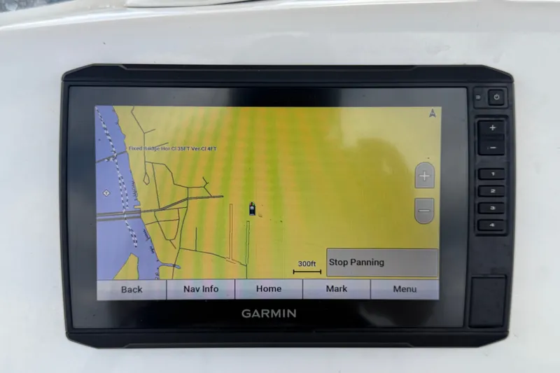 Slide: The Image of Garmin navigation display on a 2020 Tidewater 2110 Bay Max boat, showing a coastal map. - 17