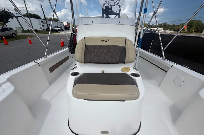 Slide: The Image of 2020 Tidewater 2110 Bay Max boat interior with seating and cup holders. - 42