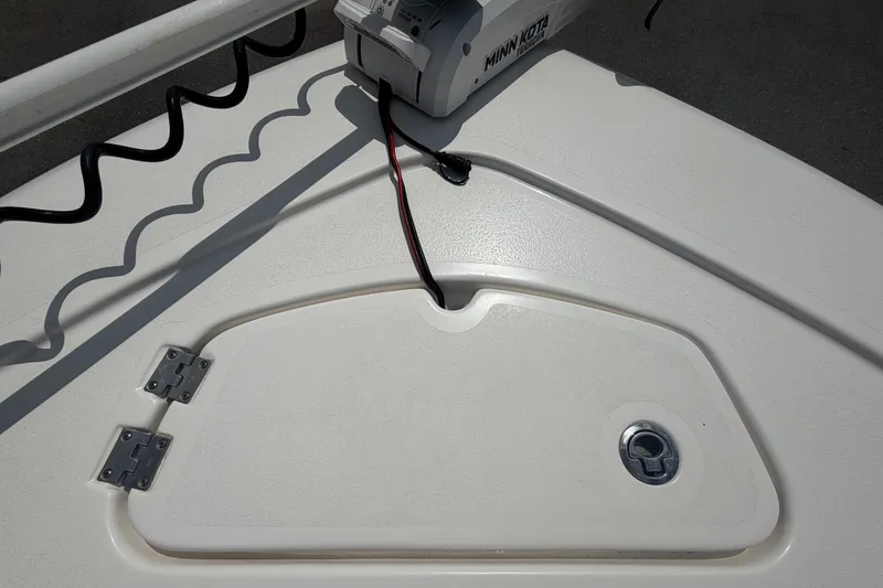 Slide: The Image of The image shows the deck of a 2020 Tidewater 2110 Bay Max boat with a Minn Kota motor. - 35
