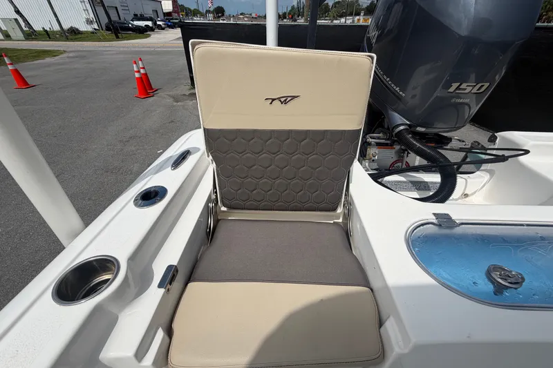 Slide: The Image of 2020 Tidewater 2110 Bay Max boat interior with seating and Yamaha 150 engine. - 50