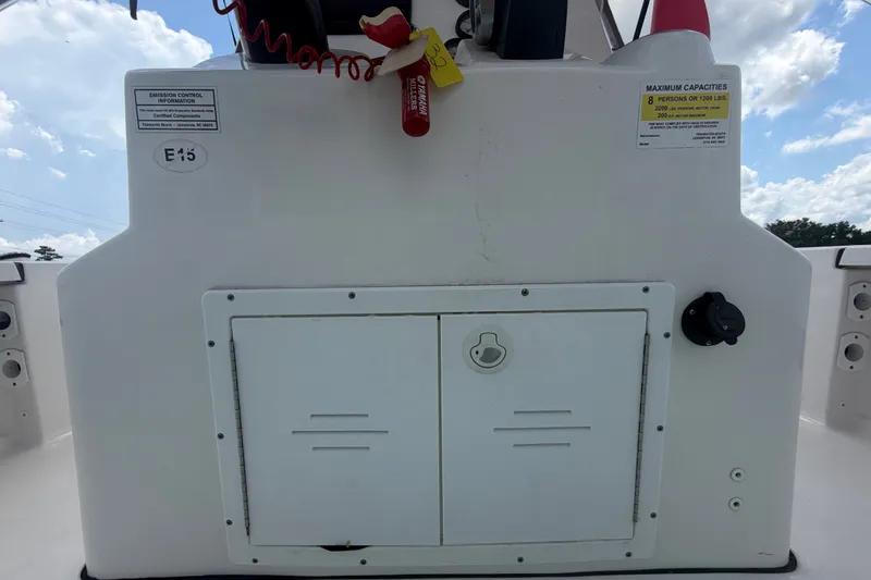 Slide: The Image of Tidewater 2110 Bay Max 2020 boat console with storage compartment and safety equipment. - 22