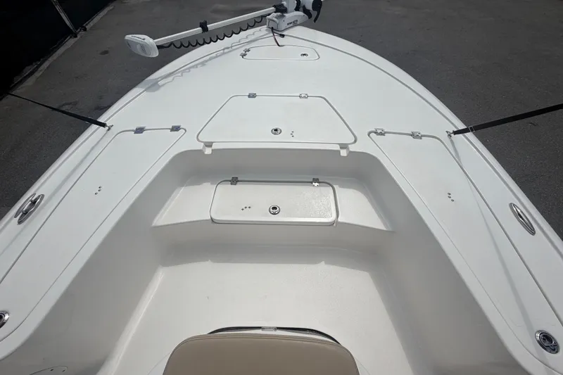 Slide: The Image of 2020 Tidewater 2110 Bay Max boat deck with storage compartments and trolling motor. - 27